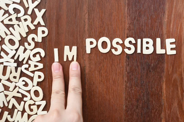 Word impossible made with block wooden letters — Stock Photo, Image