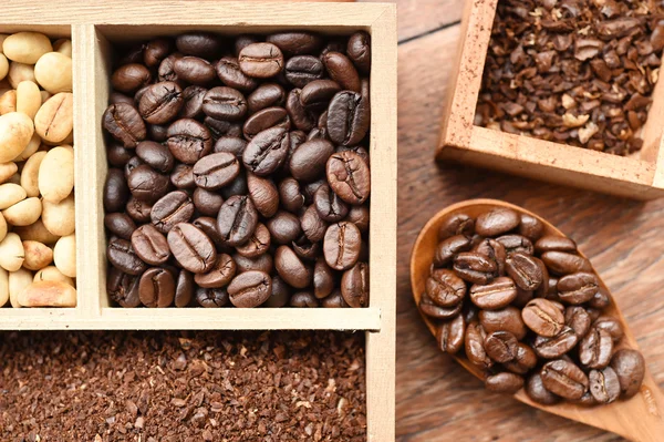 different coffee forms in wooden box and coffee bean in wooden spoon