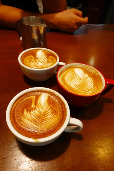 Cup of latte art coffee — Stock Photo, Image