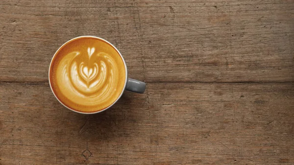 Una Taza Café Latte Arte Sobre Fondo Madera — Foto de Stock