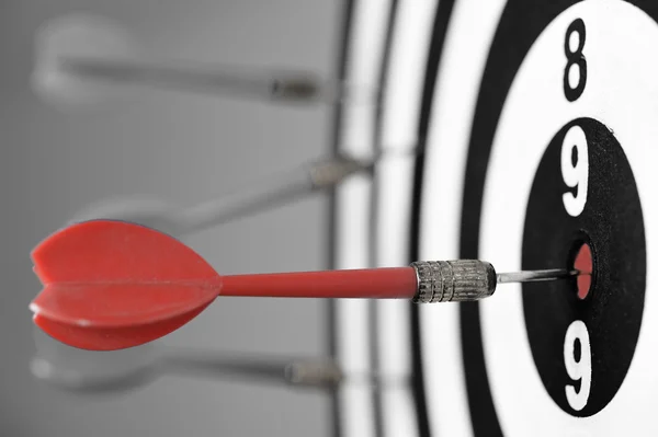 Dartboard with red darts — Stock Photo, Image