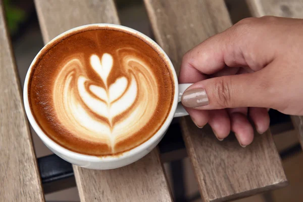 A cup of latte art coffee — Stock Photo, Image