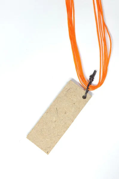 Wooden tag with orange tag — Stock Photo, Image