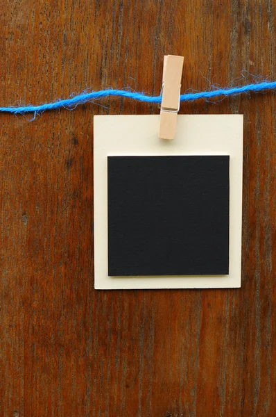 Blank photo frames on blue line — Stock Photo, Image