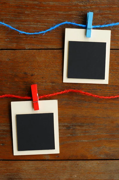 Blank photo frames on red and blue line — Stock Photo, Image