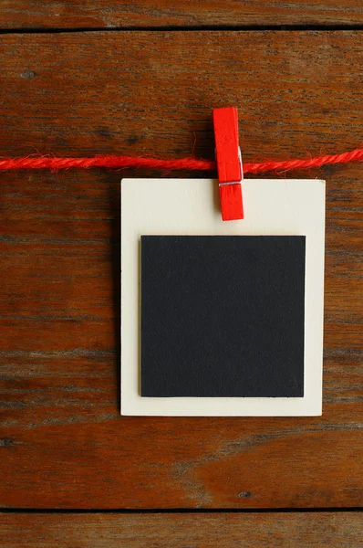 Blank photo frames on red line — Stock Photo, Image