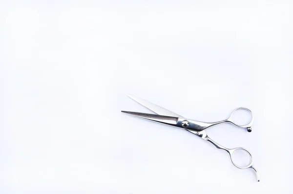 Tesoura de cabelo em mãos — Fotografia de Stock