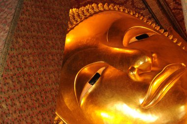 Yatan Buda heykeli altın yüzü. Wat Pho, Tayland