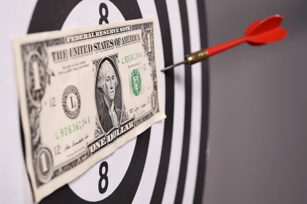 One dollar bill on a dartboard — Stock Photo, Image