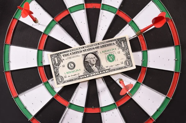 One dollar bill on a dartboard — Stock Photo, Image
