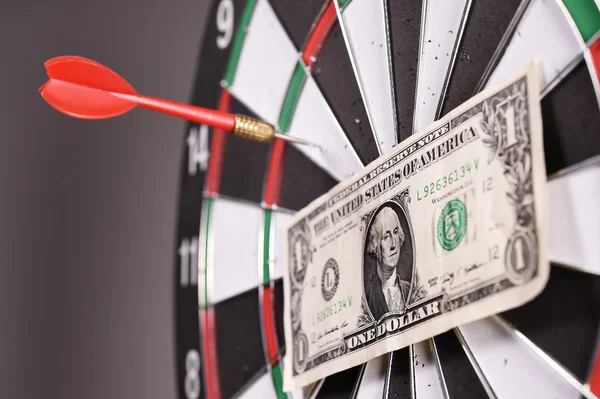 One dollar bill on a dartboard — Stock Photo, Image