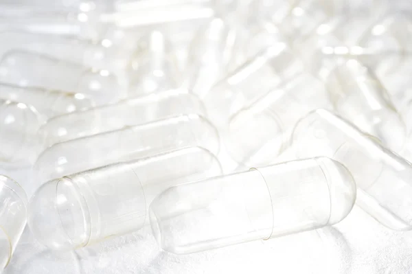 Empty capsules for medicine background — Stock Photo, Image