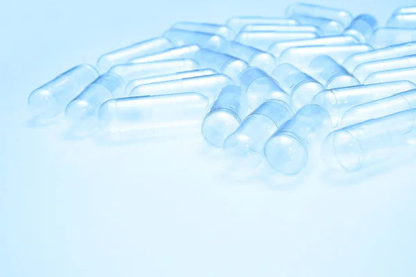 Empty capsules for background — Stock Photo, Image