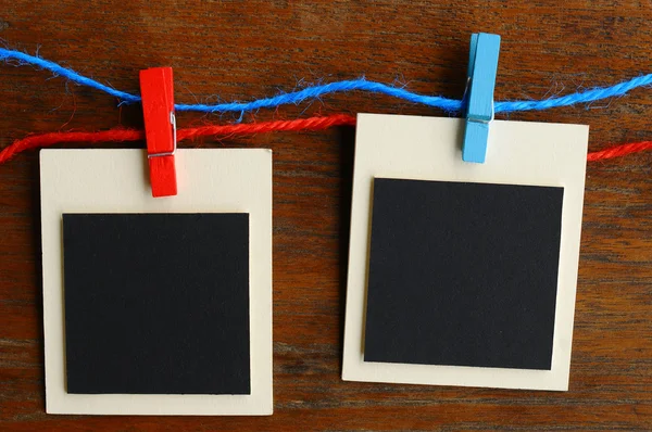 Blank photo frames on red and blue line — Stock Photo, Image