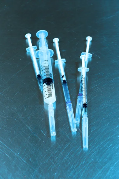 Syringes of different size — Stock Photo, Image