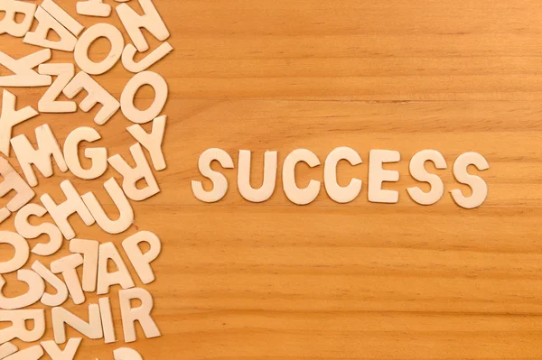 Palavra de sucesso feito com letras de madeira bloco — Fotografia de Stock