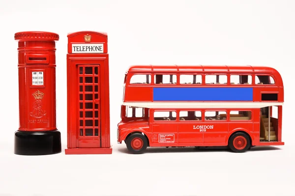 Postbox a červené telefonní budky s červený autobus — Stock fotografie