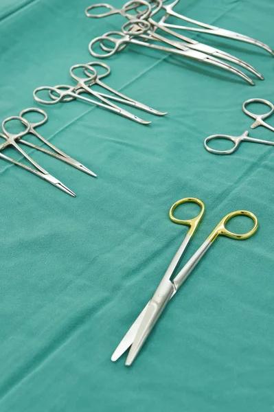 Detail shot of steralized surgery instruments with a hand grabbing a tool — Stock Photo, Image