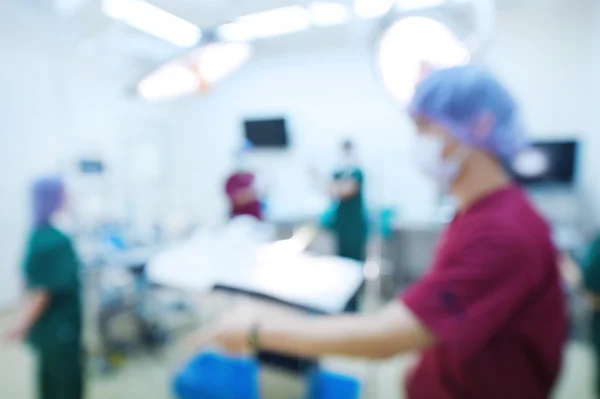 Desenfoque del grupo de cirugía veterinaria en la sala de operaciones — Foto de Stock