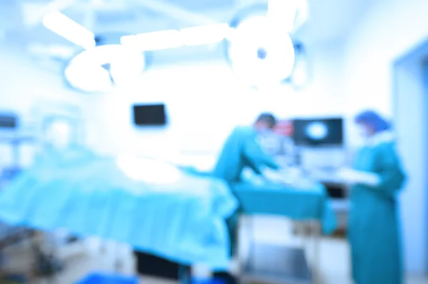 Blur of two veterinarian surgeons in operating room — Stock Photo, Image