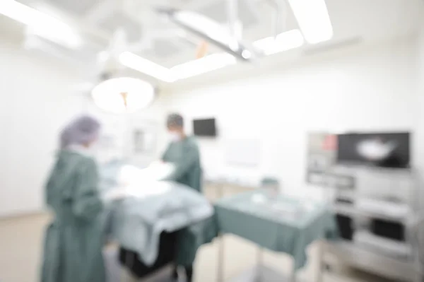 Blur of two veterinarian surgeons in operating room — Stock Photo, Image