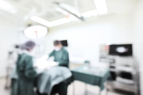 Blur of two veterinarian surgeons in operating room — Stock Photo, Image