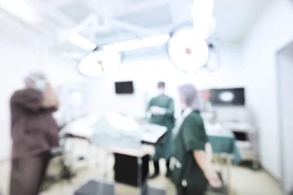 Desenfoque del grupo de cirugía veterinaria en la sala de operaciones — Foto de Stock