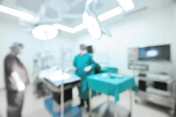 Blur of two veterinarian surgeons in operating room — Stock Photo, Image