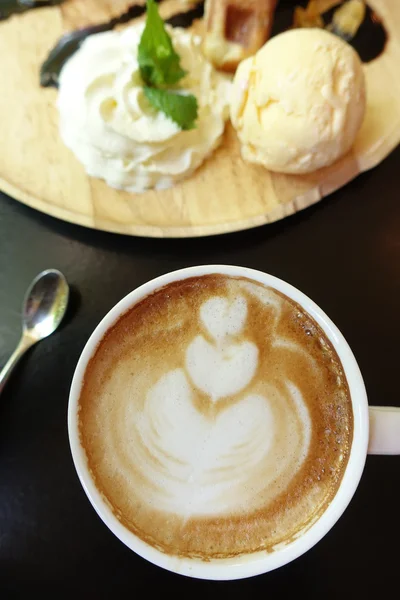 Cup of latte art coffee and ice cream — Stock Photo, Image