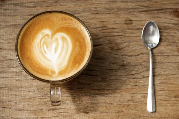 Cup of latte art coffee — Stock Photo, Image