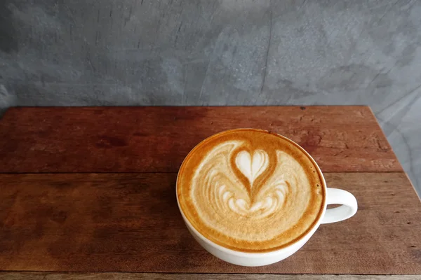 Cup of latte art coffee — Stock Photo, Image