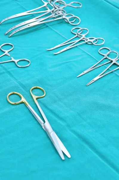 Detail shot of steralized surgery instruments with a hand grabbing a tool — Stock Photo, Image