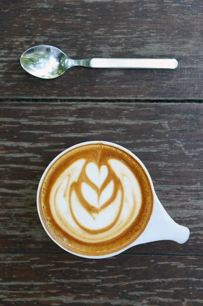 Cup of latte art coffee — Stock Photo, Image