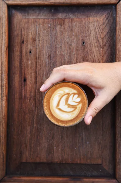 A cup of latte art coffee — Stock Photo, Image
