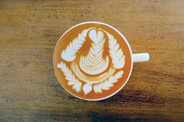 Cup of latte art coffee — Stock Photo, Image