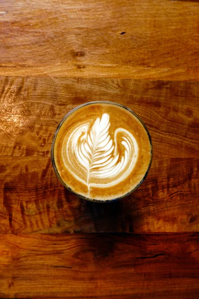 Cup of latte art coffee — Stock Photo, Image