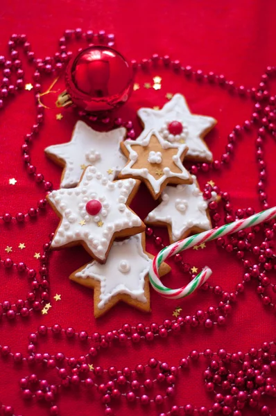 Cookies in the shape of a star on a red tablecloth — Stock Photo, Image