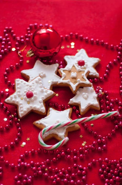 Cookies in the shape of a star on a red tablecloth — Stock Photo, Image