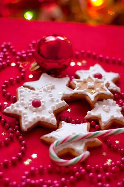 Cookies in the shape of a star on a red tablecloth — Stock Photo, Image