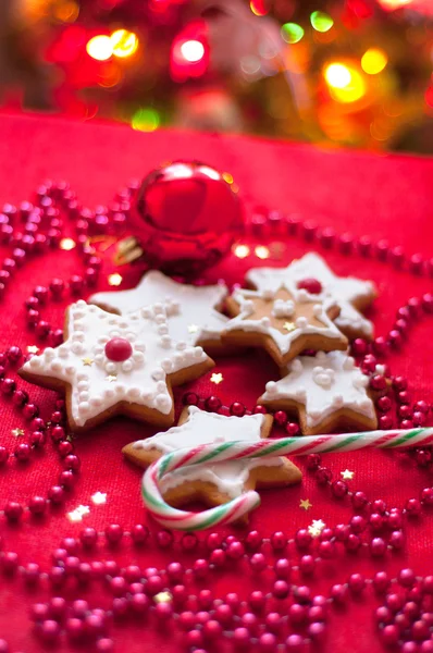 Cookies in the shape of a star on a red tablecloth — Stock Photo, Image