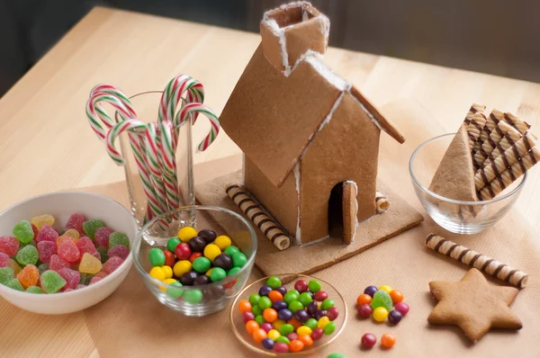 Decorating a Christmas Gingerbread House Stock Image