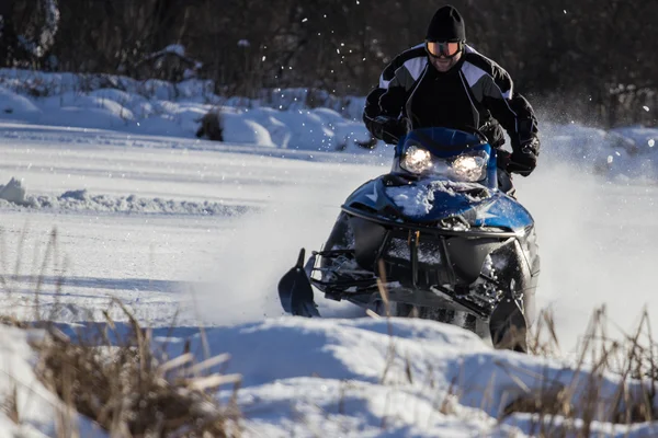 Snowmobile driving Royalty Free Stock Images