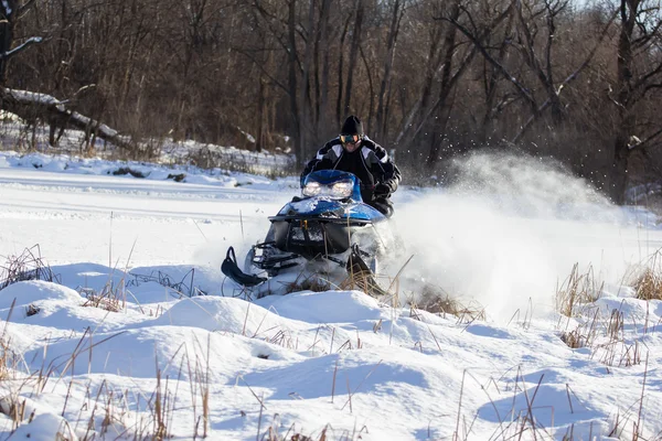 Snowmobile driving Stock Image