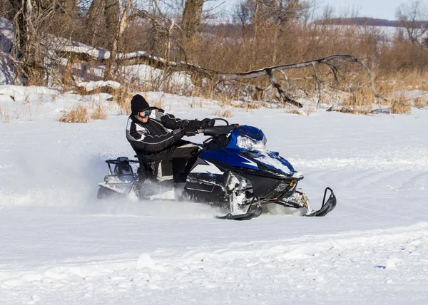 Snowmobile driving Royalty Free Stock Images