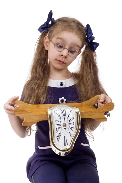 Little girl holding a clock Stock Picture