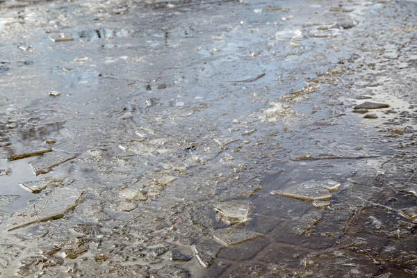 Puddles and chopped ice — Stock Photo, Image