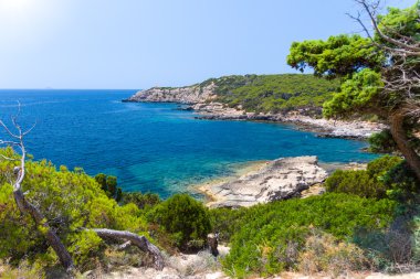 Rocky cliffs and clear sea