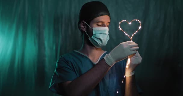 Doctor Holding Heart Shaped Garland Hand — Stock Video