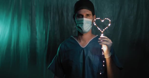 Doctor Holding Heart Shaped Garland Hand — Stock Video