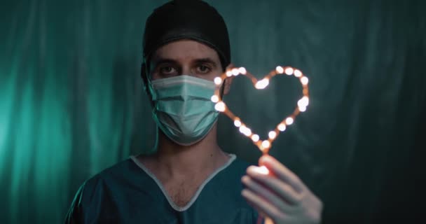 Doctor Holding Heart Shaped Garland Hand — Stock Video